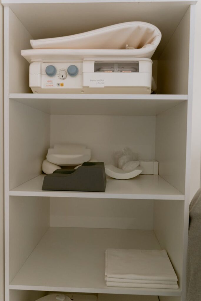 Organized shelves with medical equipment and supplies in a healthcare setting.